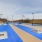 a swimming pool with a blue tile floor and a blue sky