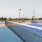 a swimming pool with solar panels